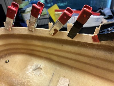 Bulwark installation. Shims are to create constant width between hull side & bulwark. Gap is closed by a covering board.